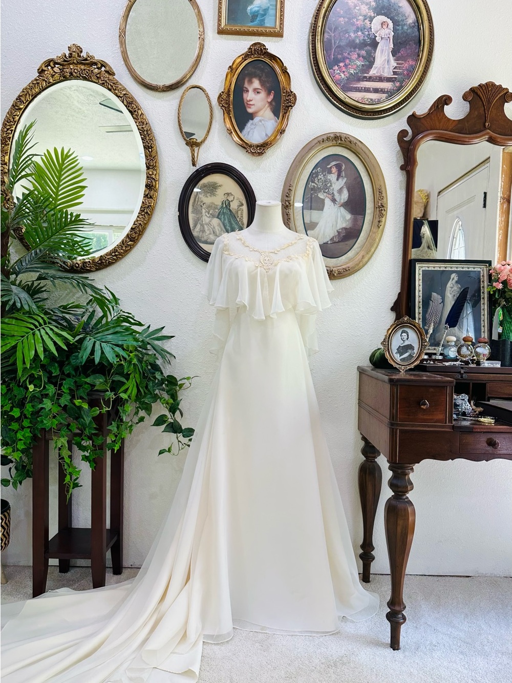 Elegant Ivory Bridal Gown with Ruffled Capelet